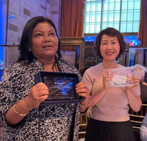 Dr. Kathy S. Tan and Dr. Zakia Hossain holding their United Hospital Fund Quality Improvement Champion awards at the Tribute to Excellence in Health Care ceremony.